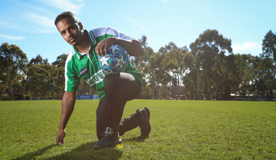 GROUNDED: Playing on grass soccer fields is one of those small details which reminds Melkie Woldemichael of how much his life has changed. Picture: JAMES WILTSHIRE
