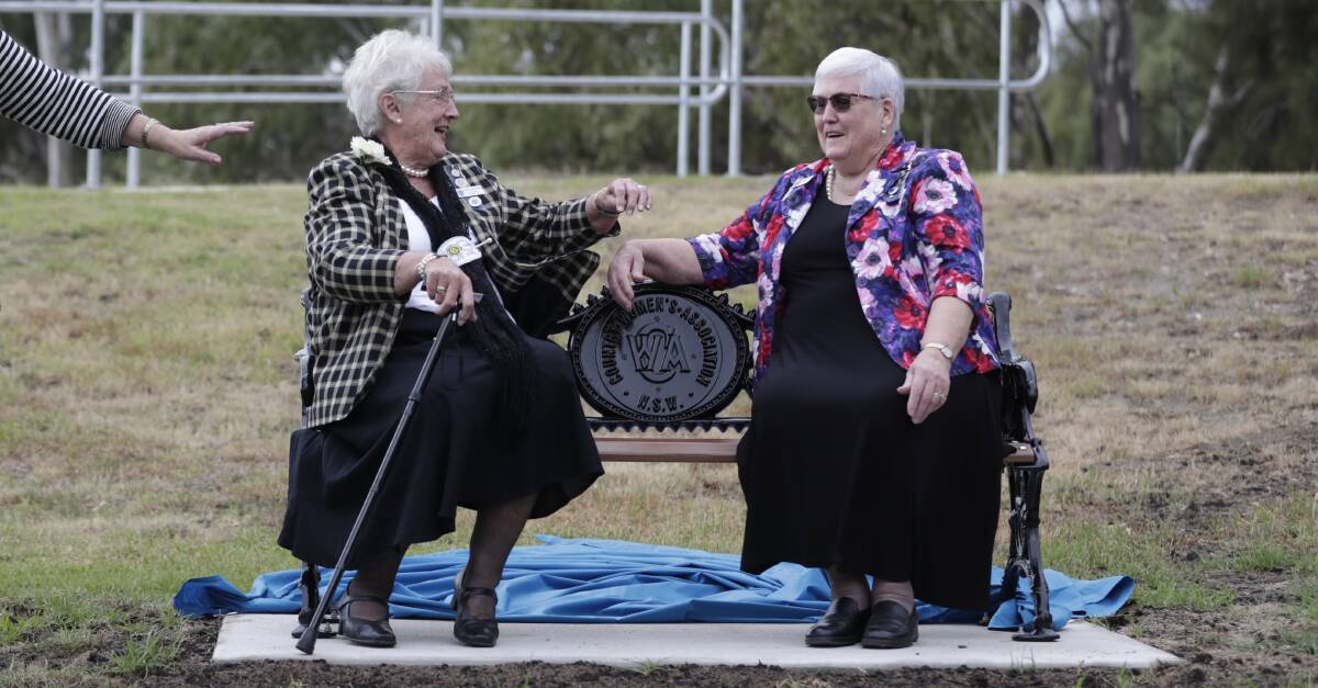 ABOVE: Past president Elaine Armstrong and current vice-president Ann Adams in Wagga earlier this month as the CWA's commemorative centenary bench was unveiled. Picture: Madeline Begley