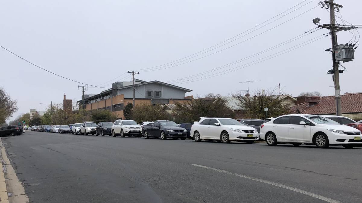 Cars were lined up all the way down Johnston Street for COVID-19 testing. Picture: Emily Wind