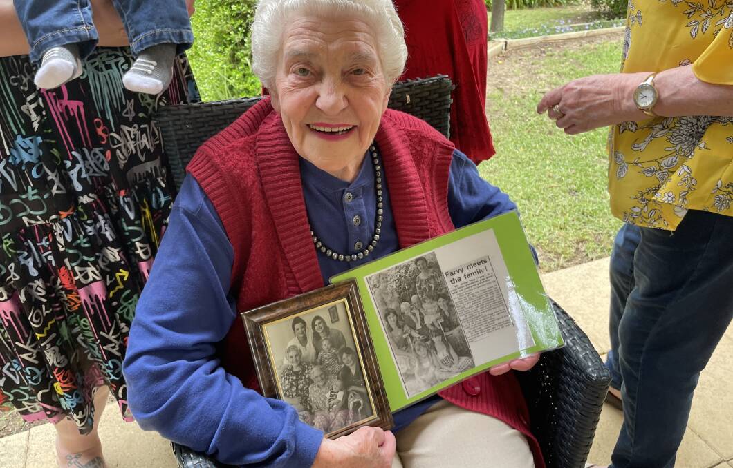 Joy Wayling holding the previous five-generation photos that she was featured in. Picture: Emily Wind