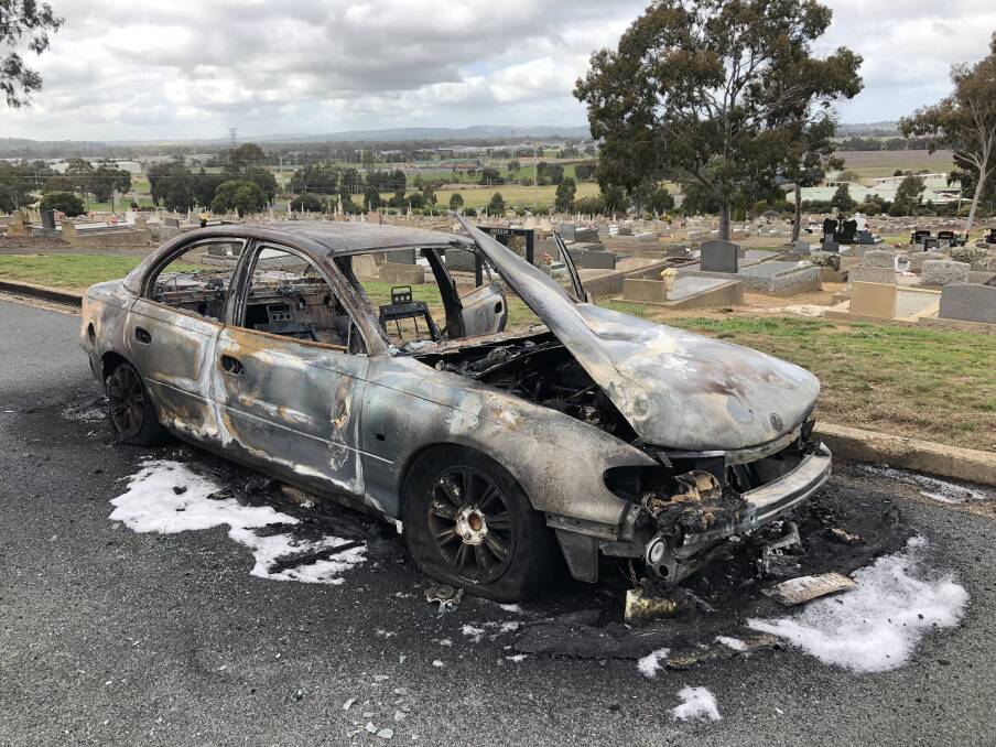 The remnants of the burnt vehicle at the Memorial Cemetery in Wagga. Picture: Emily Wind
