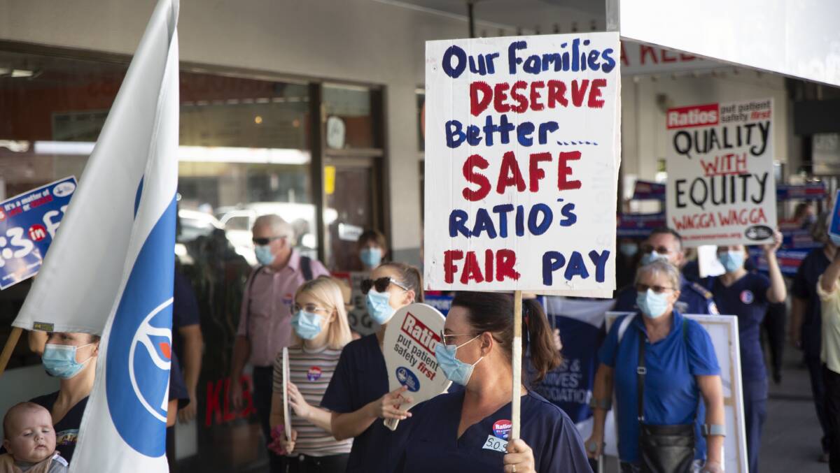 Nurses and members of the NSW Nurses and Midwives' Association march through Wagga, demanding better staff to patient ratios in hospitals. Picture: Madeline Begley