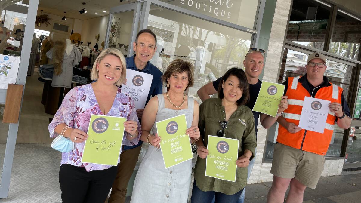 SUPPORT LOCAL: Wagga Business Chamber president Jennifer Hand, business owner Dale Allison, Ted and Olive Boutique employee Glenys Yates, business owners Joo-Yee Lieu and Richard Moffatt, and chamber VP Tim Sheather.