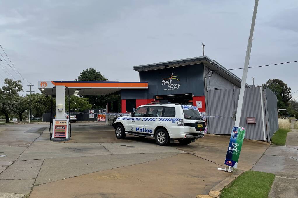The Fast n Ezy service station in Mount Austin was cordoned off on Thursday evening following the alleged robbery. Picture: Emily Wind