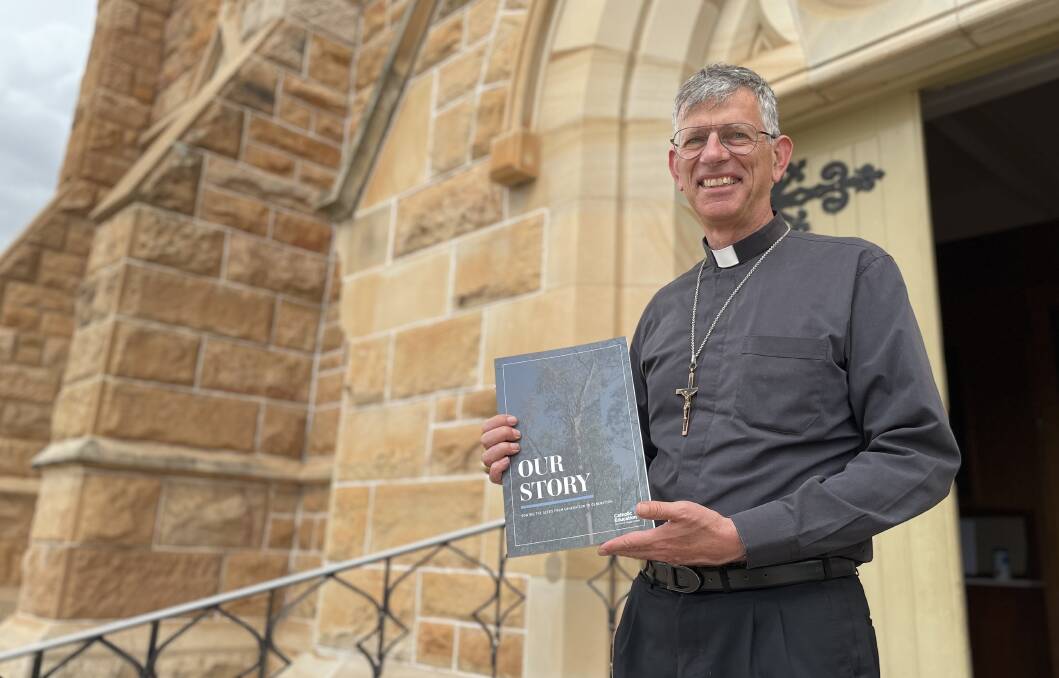 Wagga Bishop Mark Edwards launched the diocese's new commemorative book on Wednesday. Picture: Emily Wind