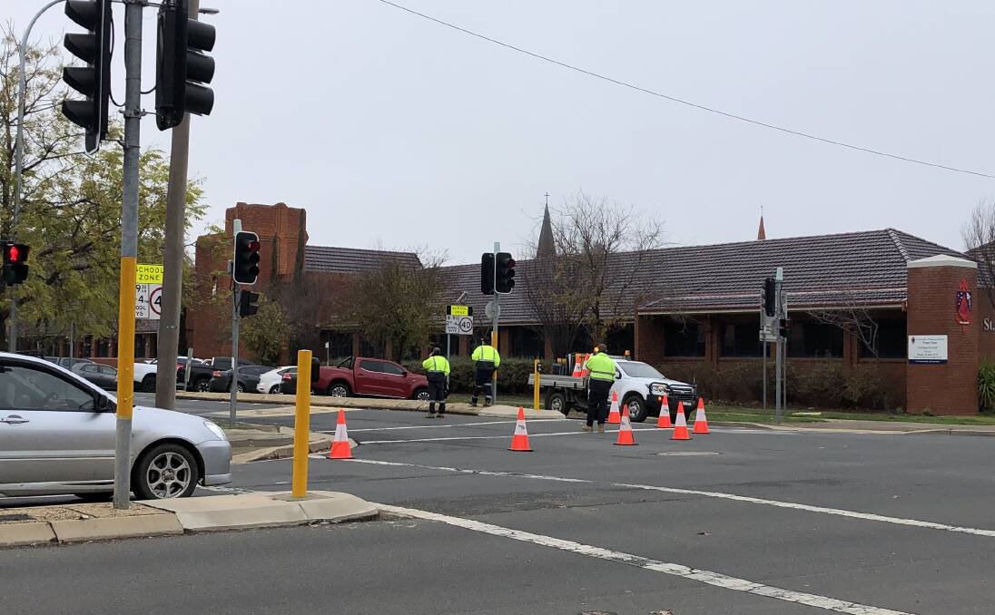 Police monitored the intersection of Johnston Street and Tarcutta Street on Monday morning due to the high volume of traffic. Picture: Emily Wind