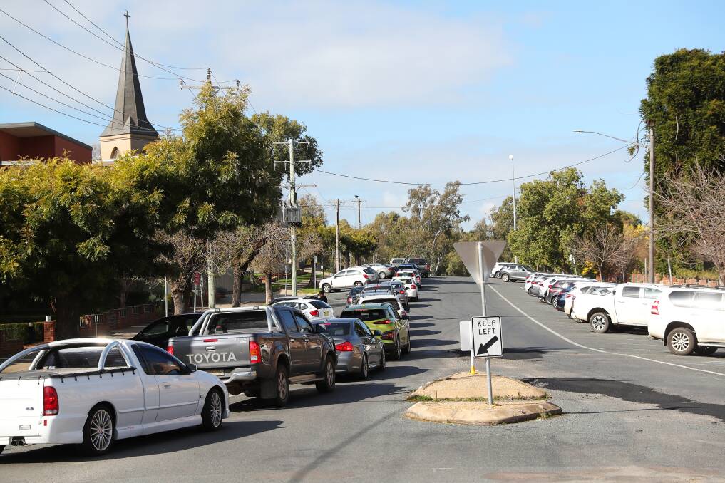 Cars lining up to be COVID tested at Laverty Pathology's clinic near the Riverina Playhouse. Picture: Emma Hillier