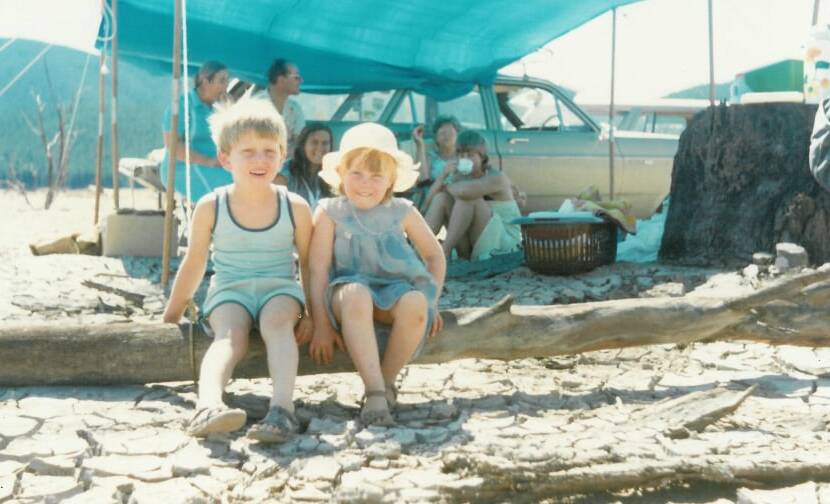 Chris and his sister Rosemarie celebrate New Year's Day at Blowering Dam as children. Picture: Francisca Boshuizen