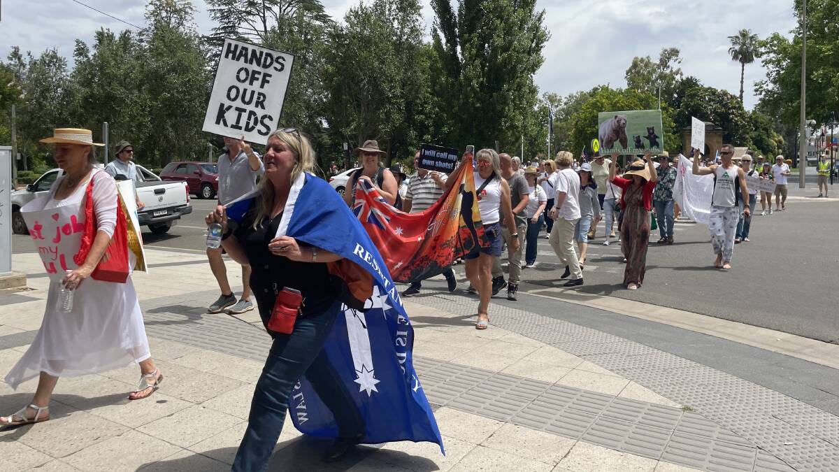 More than 100 people marched down Baylis Street on Saturday in protest of COVID-19 vaccination mandates. Pictures: Emily Wind
