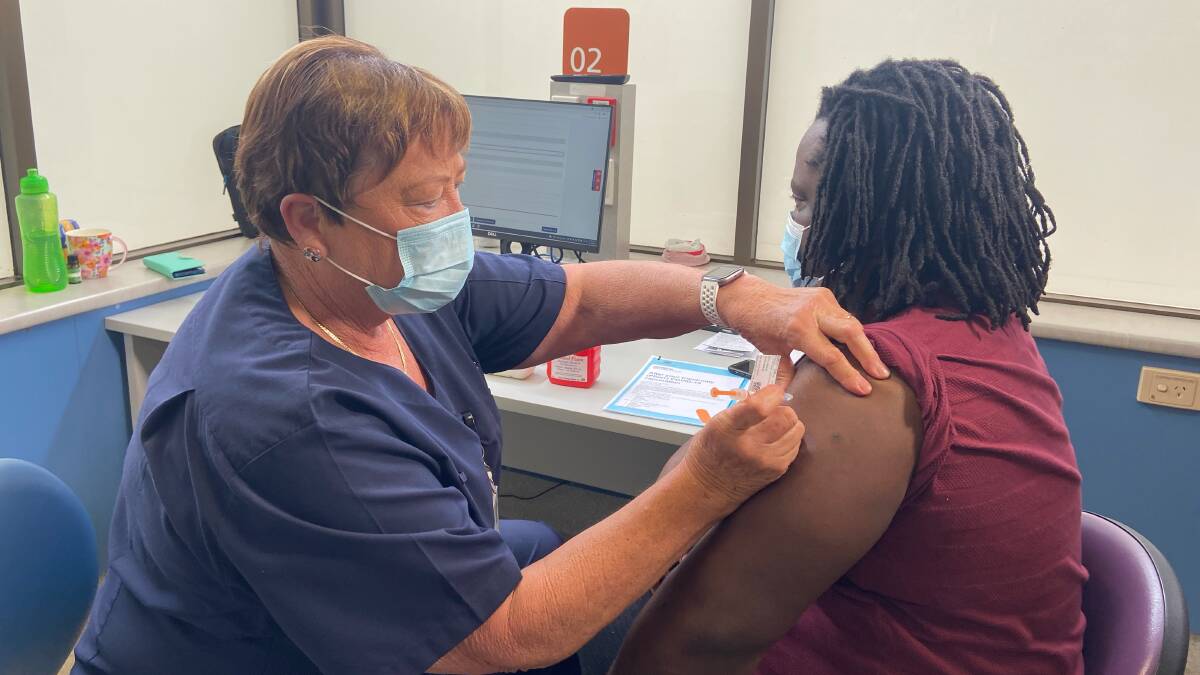 Tapiwa Kanduka receiving his second COVID-19 shot in Wagga on Wednesday - the 50,000th COVID shot administered by the Murrumbidgee Local Health District.