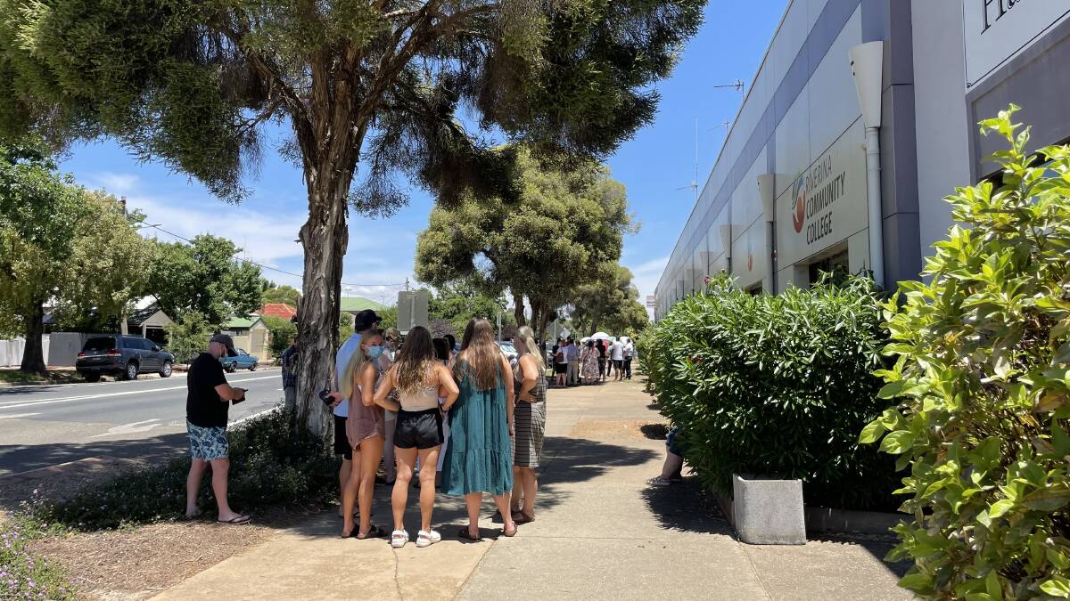 Groups of people were queued all the way down Murray Street on Sunday afternoon to receive a COVID-19 test, almost two hours after the MLHD-run clinic was due to close. Picture: Emily Wind