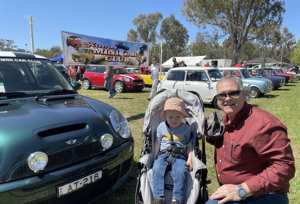 FAMILY FUN: Mini car enthusiasts Cohen and Walter Dominguez enjoyed looking at all the vehicles on display at the Mini Muster on Saturday out in the sunshine. Picture: Emily Wind