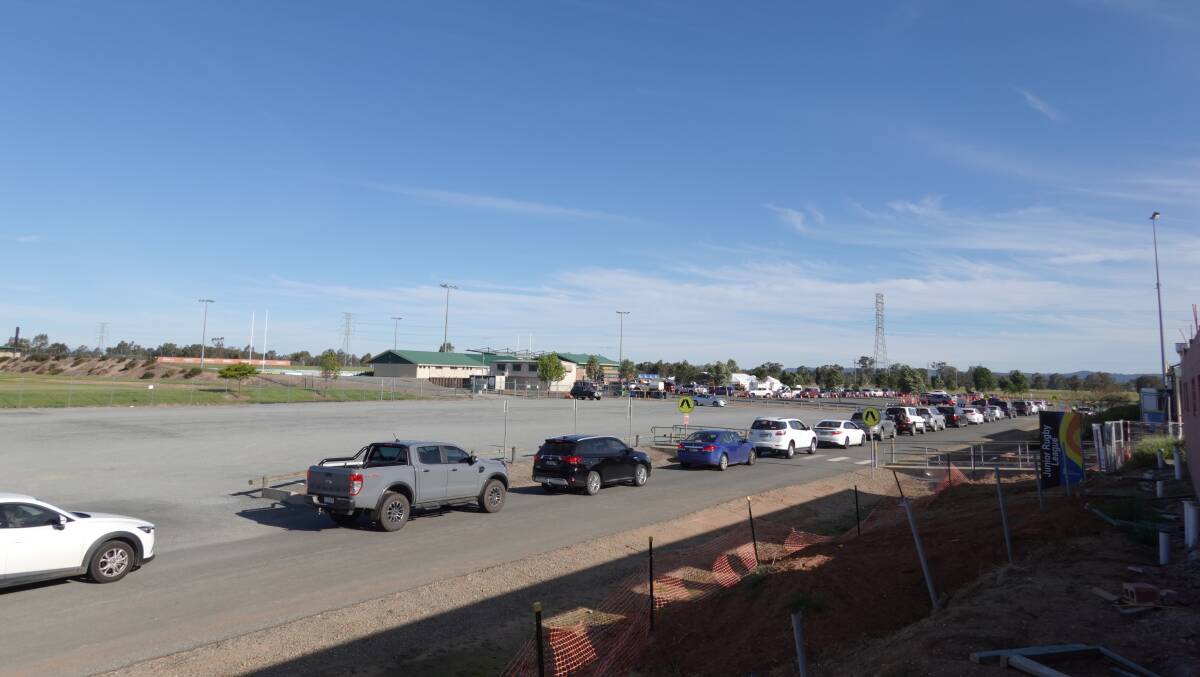 Cars lining up for COVID testing at Wagga's Equex Centre on Thursday evening. Picture: Monty Jacka
