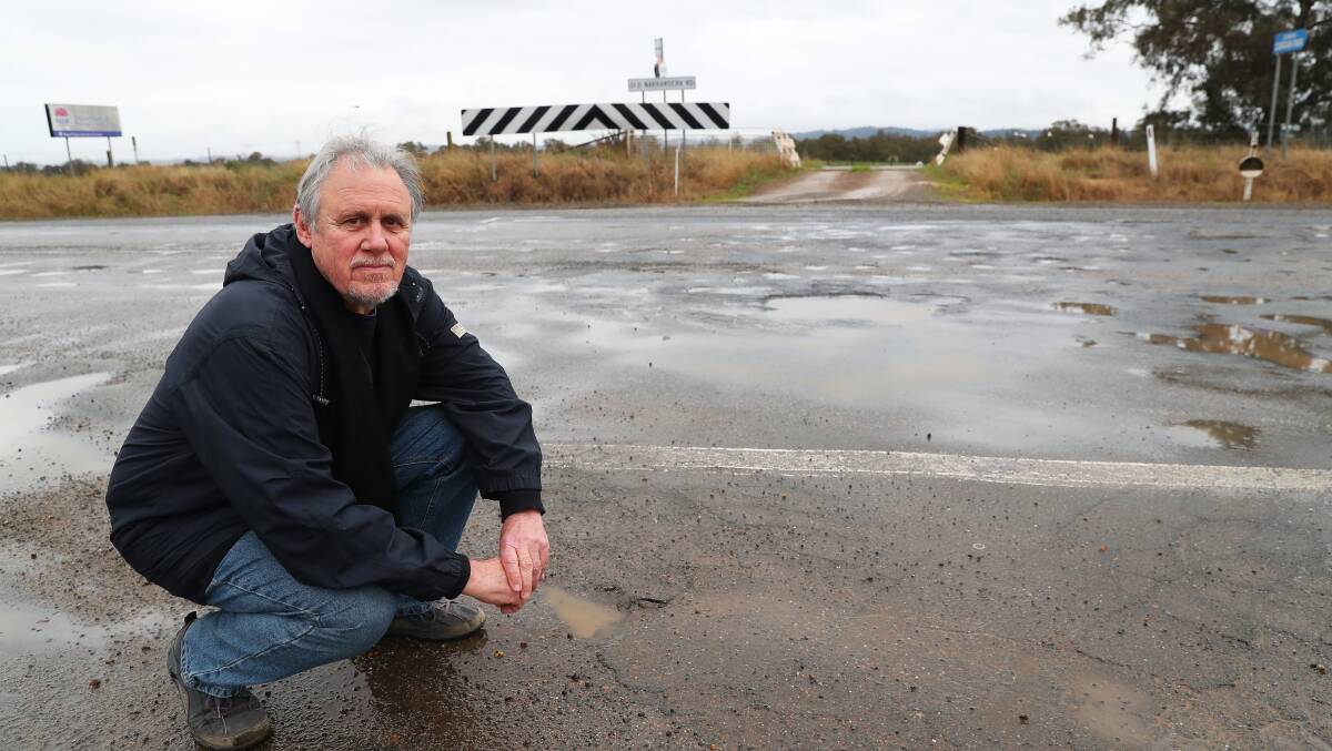 WORRIED: Dr John Carstens is not happy with the council's recent management of potholes along the intersection of Pine Gully Road and Old Narrandera Road. He believes a serious accident is awaiting. Photo: Emma Hillier 