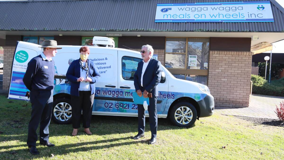 SPEEDY MEALS: Riverina Water chief executive officer Andrew Crakanthorp, Meals on Wheels manager Julie Logan and Wagga Meals on Wheels president John Craig discuss the benefits of the new delivery van. Picture: Les Smith