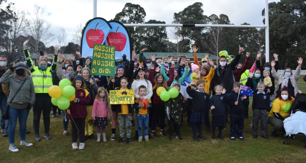 BATLOW PRIDE: A group of Do it for Batlow members send a message to Batlow-bred Sharni Williams during an event to show the Olympian support at Batlow Showground. Picture: Sean Cunningham