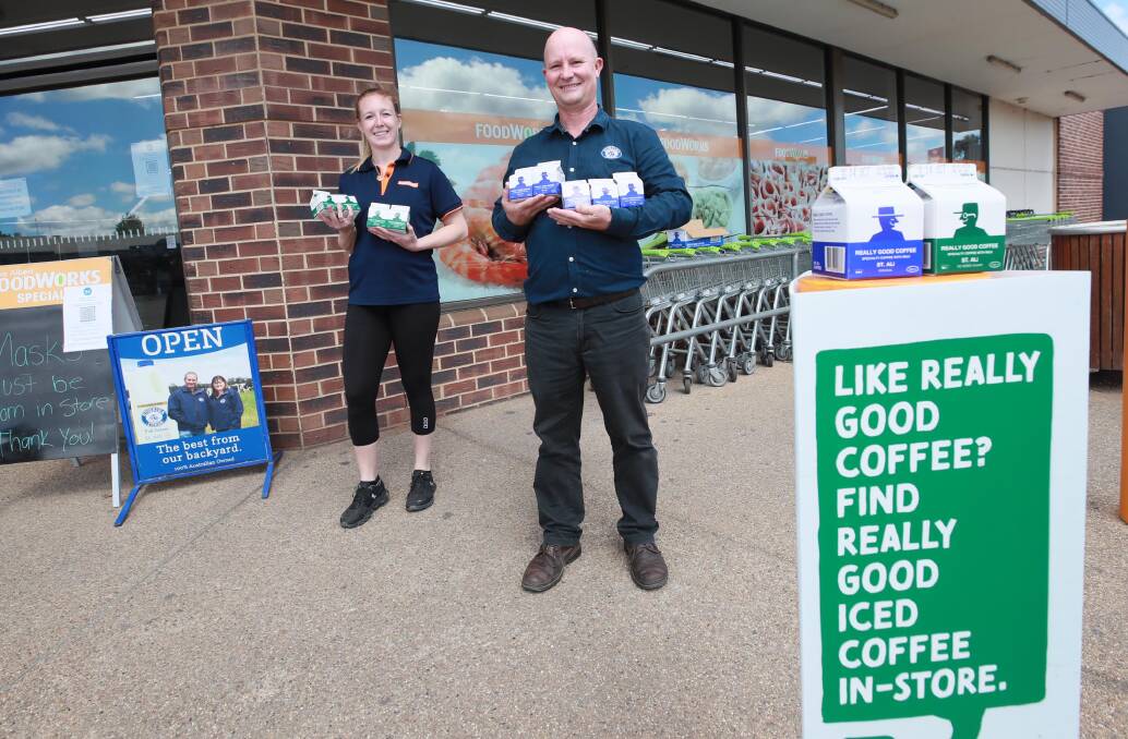 PREMIUM PRODUCT: Foodworks Lake Albert store manager Bailey Lucas and Riverina Fresh sales manager Jason Brett display the newly launched iced coffee drink, Really Good Coffee. Picture: Les Smith