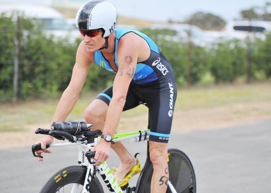 PEDAL POWER: Triathlete Brad Kahlefeldt competing in an event in Temora.