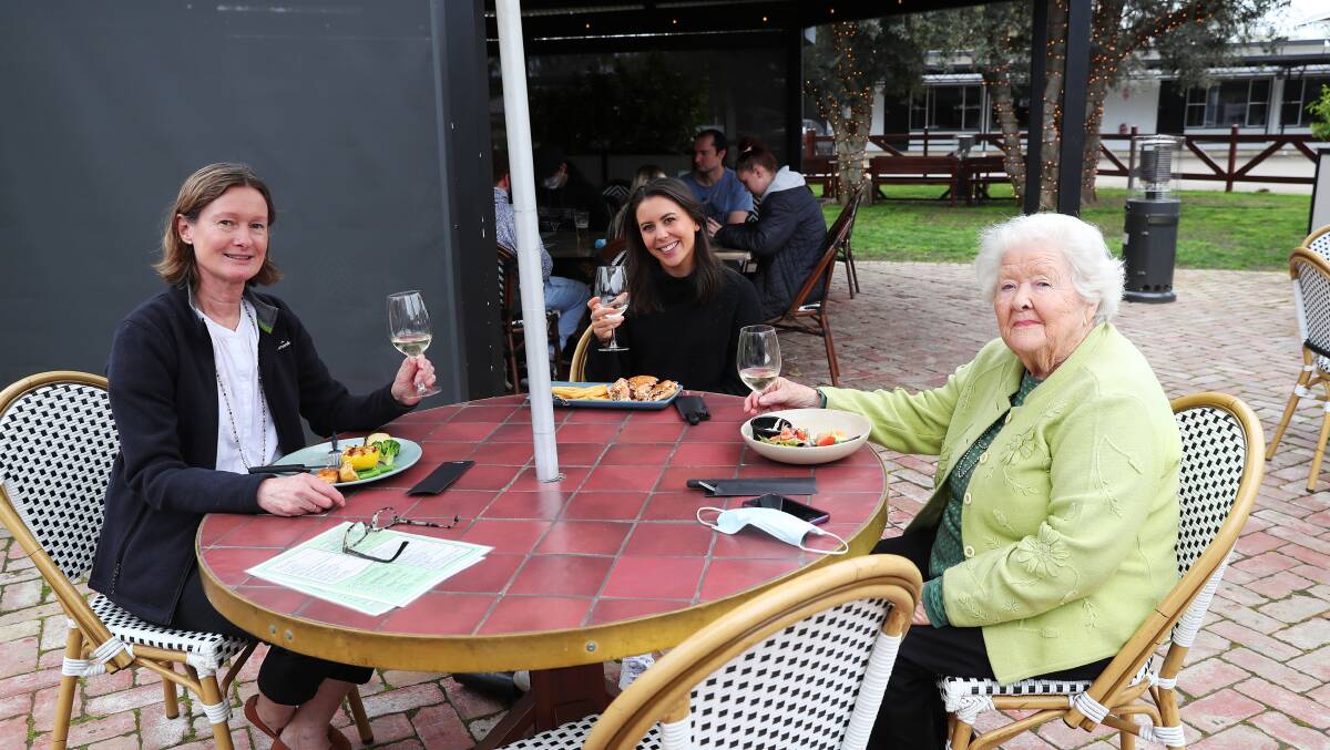 CATCHING UP: Susan Parnell, Annabel Adams and Barbara Parnell raised a glass at the Palm and Pawn Hotel on Sunday. Picture: Emma Hillier