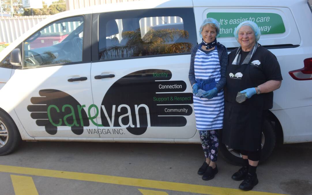 BACK ON TRACK: Carevan volunteer Jenny Conkey and project manager Lynne Graham help feed those in need. Picture: Sean Cunningham