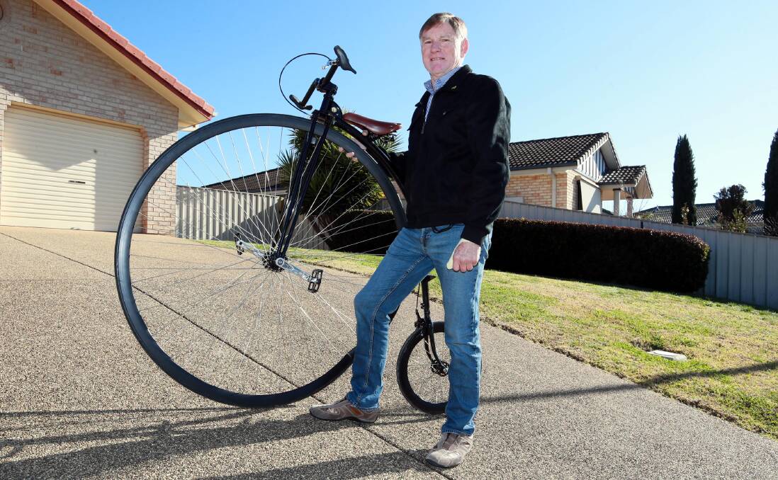 HEAD TURNER: Bob Reynolds is a man of many talents who combines his passions of cycling, origami and coffee drinking. He attracts much attention while cycling his penny farthing around Wagga's streets and beyond. Picture: Les Smith 
