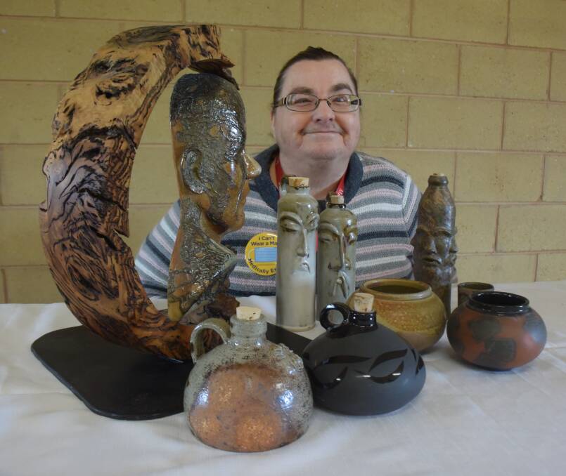POTTERY FOR PICKERS: Uranquinty Garage Sale and Craft Fair organiser Rhonda Palmer with a display of items made by Wagga Potters Club. Picture: Sean Cunningham