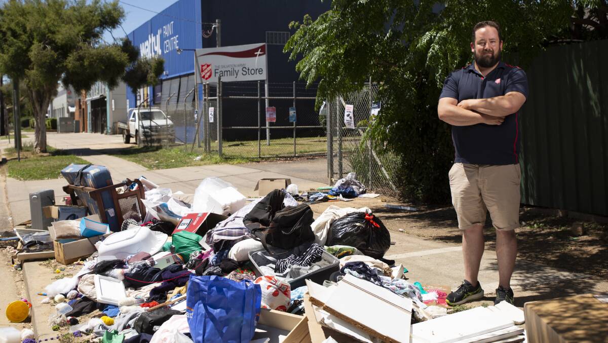 CHARITY 'BIN': Acting store manager Mathew George at Wagga Salvation Army Family Store stands beside a pile of illegally dumped 'donations'. Picture: Madeline Begley