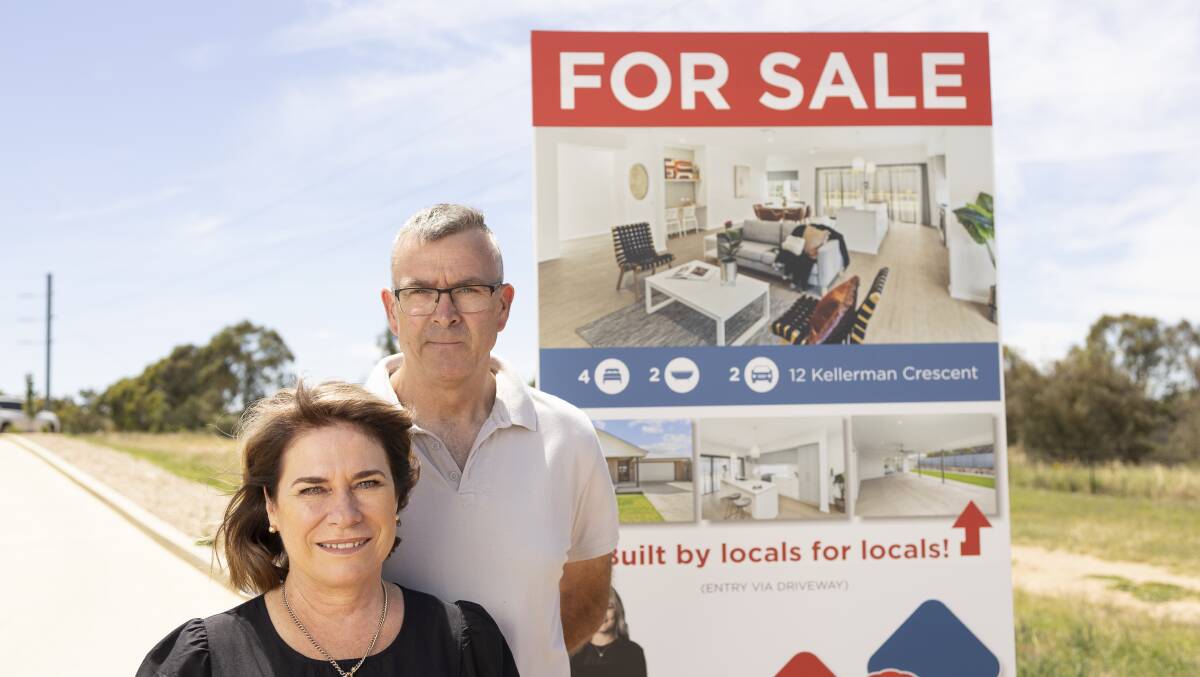 'LOOKED AFTER': Cathy and Geoff Reid on site of the brand new Boorooma home advertised by RE/MAX real estate at no cost. Picture: Ash Smith. 