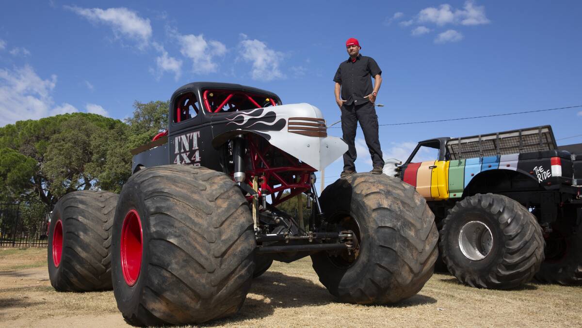 ENGINES HOT: American monster truck driver Kevin King with one of the custom trucks he has done up and will debut over the weekend. Picture: Madeline Begley