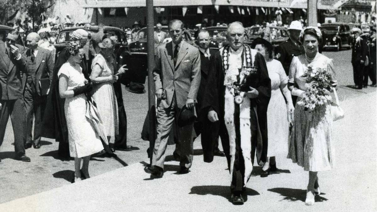 ROYAL VISIT: Mayor of Wagga Alderman WF Dunne escorting Queen Elizabeth II towards Wagga's Memorial Gardens. Picture: Tom Lennon Collection, CSU Regional Archives.