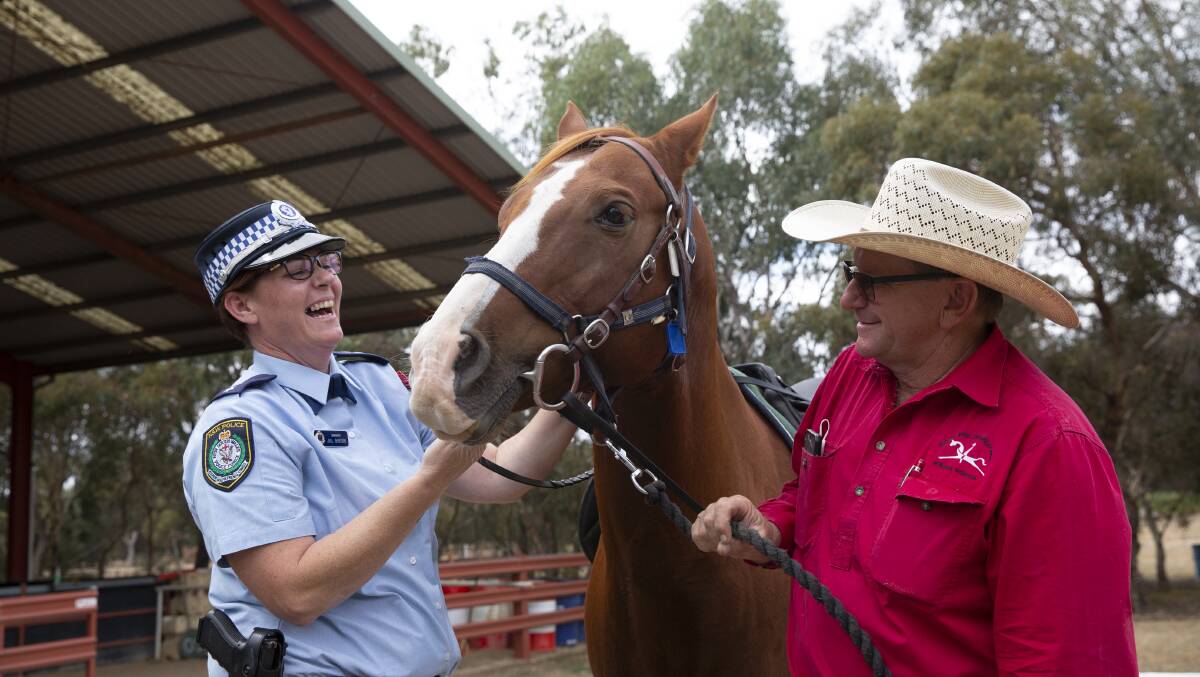 COMMUNITY SPIRIT: Acting Inspector Jill Gibson and head coach of Riding for the Disabled Wagga Darren Judd with horse Storm ahead of NSW Mounted Police's exhibition this Saturday at Riding for the disabled Wagga. Picture: Madeline Begley
