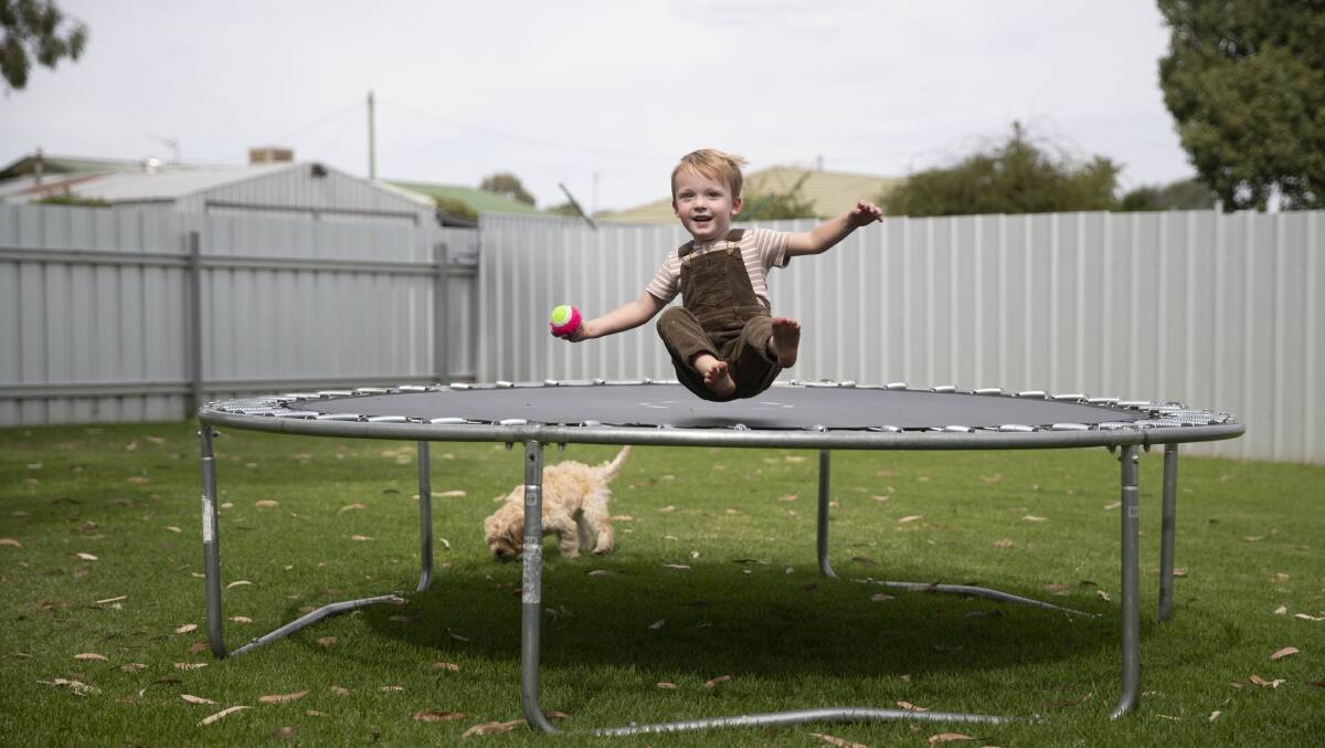 HOPE: 2-year-old Hunter Crowder, who has cystic fibrosis, exercising his lungs in his backyard. Picture: Madeline Begley