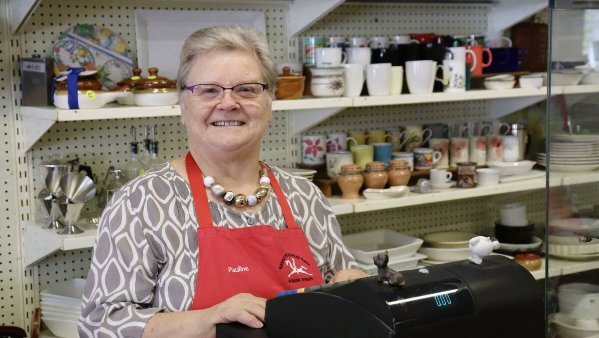 SERVICE WITH A SMILE: RDA Op-Shop Vounteer Pauline Roberts said she does not remember a time the store was busier and suggests their prices in comparison with today's cost of living may be the cause. Picture: Hayley Wilkinson