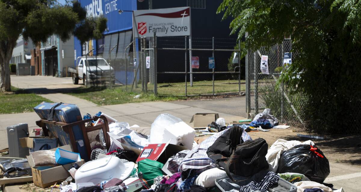 The pile of illegally dumped 'donations' discarded outside the Salvation Army Family Store on Forsyth Street. Picture: Madeline Begley
