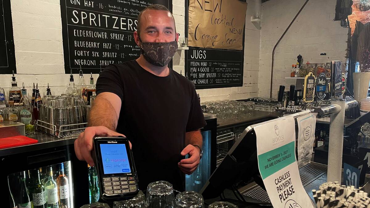 TAP AND GO: Birdhouse manager Jacson Somerville is pioneering the move to go cashless, believing many other businesses may soon recognise the benefits of the policy. Image: Hayley Wilkinson.