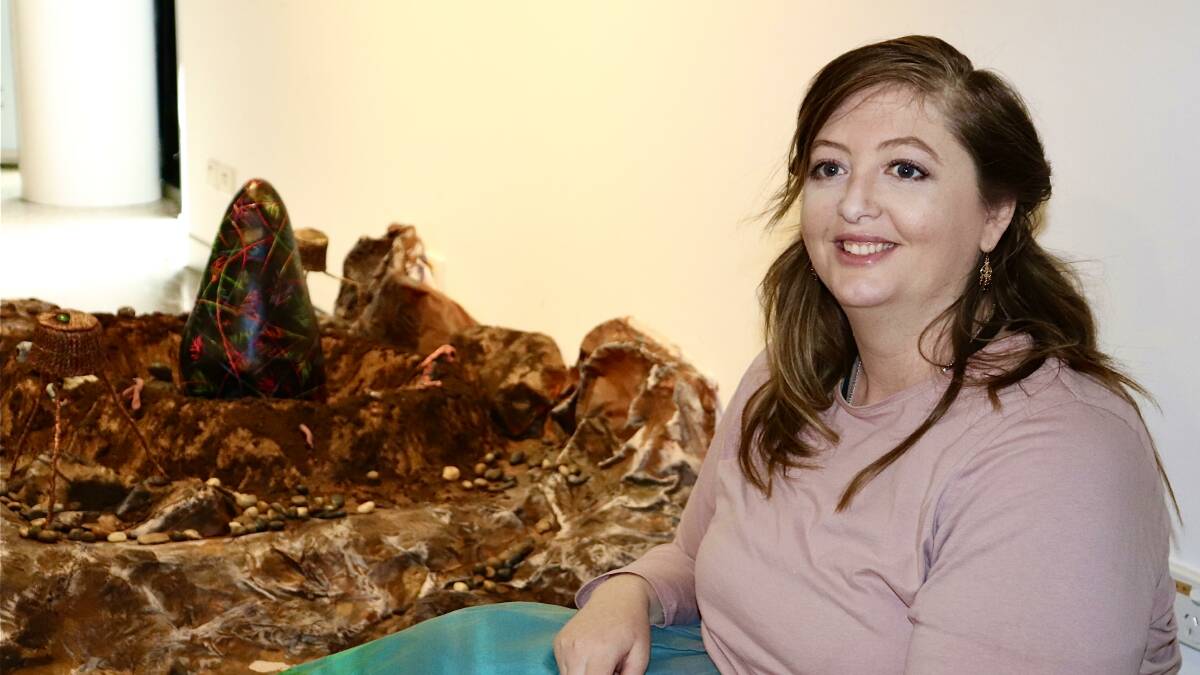 OUTER THIS WORLD: Artist Allison Davis from Coolamon with her untitled clay and mixed media artwork presented as an alien apocalypse. Picture: Hayley Wilkinson