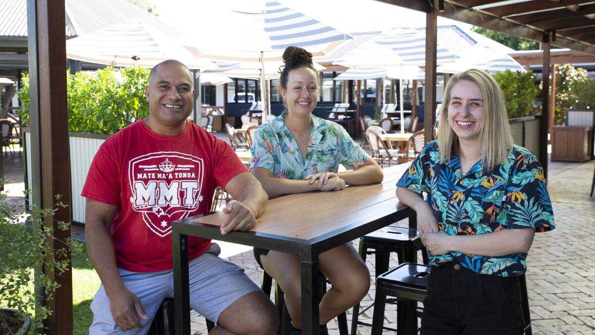 RALLYING SUPPORT: Sione 'Johnny' Fekeila, organiser of the Hope for Tonga apeal, with Palm and Pawn staff members Roxanne Renes and Bridie Lewis on location ahead of Saturday's Pasifika Fundraiser. Picture: Madeline Begley
