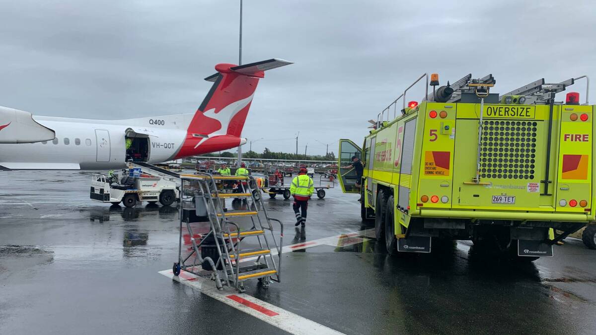 EMERGENCY: The Qantas QF 2377 flight between Wagga and Brisbane landed at 1.30pm Friday afternoon, where a passenger who suffered a medical episode while en route was intercepted by emergency services. Picture: Supplied 