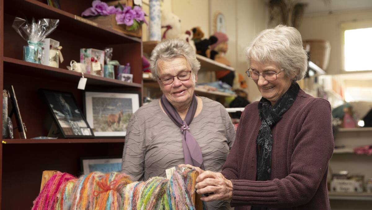 STORE'S BIRTHDAY: Farmhouse Industries volunteer Ngharie McCallum and president Fay Belling at their Tarcutta Craft Store, which will celebrate 50 years of helping the community this month. Picture: Madeline Begley