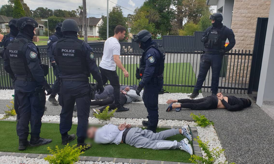BLITZ: Police make arrests in Farfield West in Sydney as part of a large operation against organised crime in which a Wagga man was also arrested. Picture: NSW Police