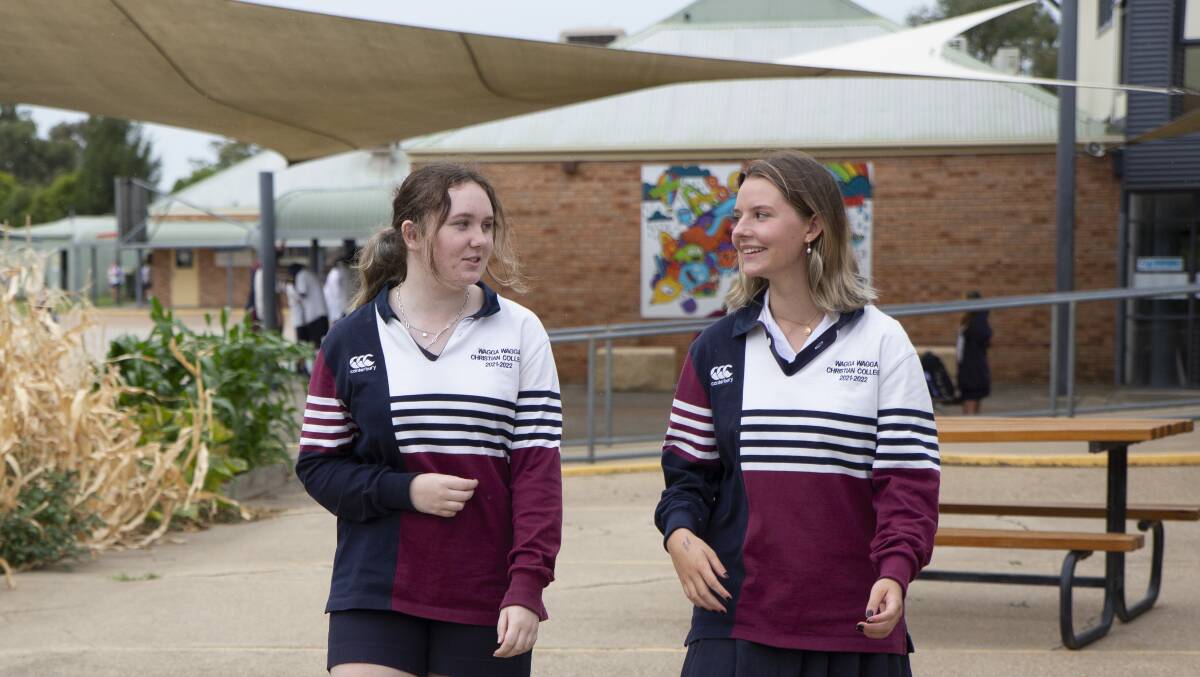 TALKING POINT: Wagga Wagga Christian College Year 12 students Anna Irish and Hannah Taylor discuss the idea of the voting age being lowered. Picture: Madeline Begley