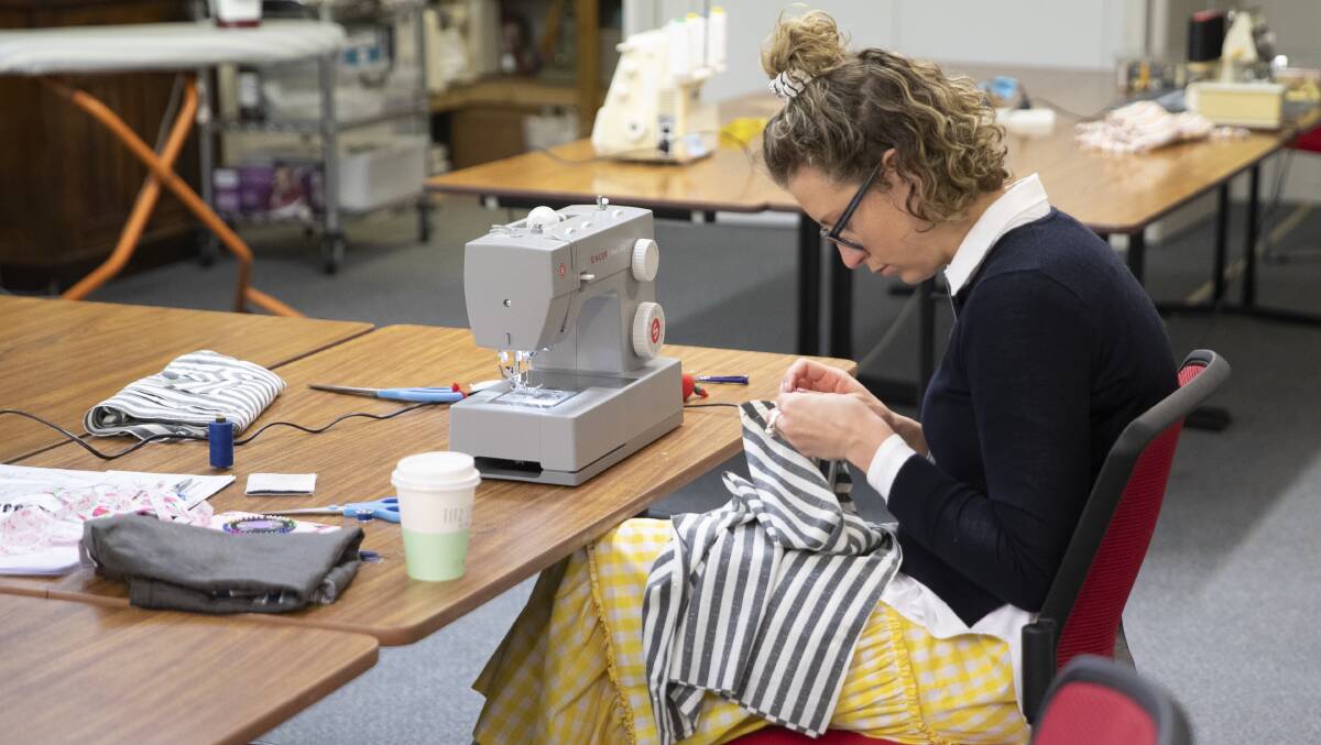 SUSTAINABLE: Bridget Burns learning at the free sewing class hosted by Bespoke Fashion Inc at the A.R.C.C. Hall. Picture: Madeline Begley 