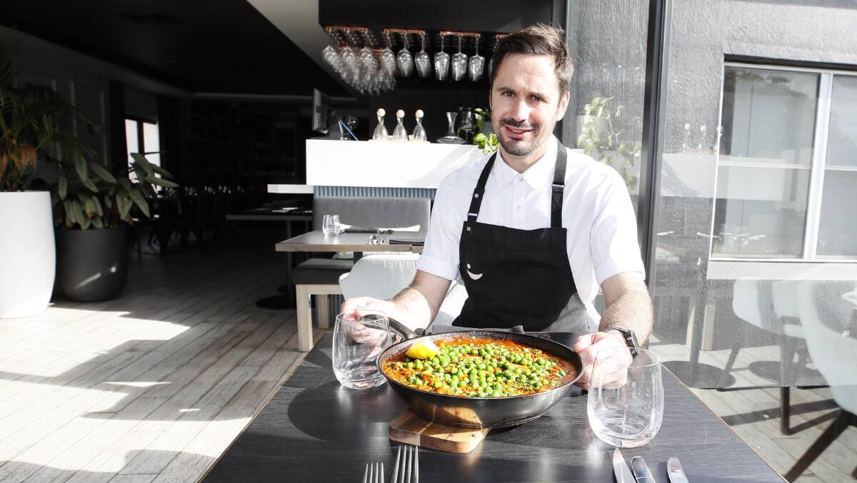 CHEAP EATS: The Charles restaurant executive chef David Obudzinski shows off his cheap, flavourfull and hearty Chicken and Chorizo Paella. Picture: Les Smith
