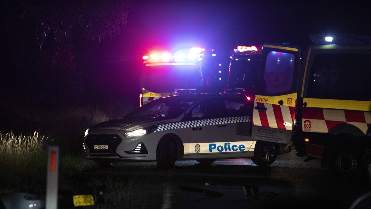 Emergency services crews at the scene of a fatal crash on Holbrook Road near Wagga on Saturday night. Picture: Ash Smith 