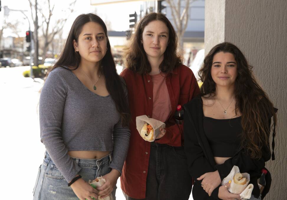 CSU students Micaela Campora-Kaal, 19, Lily Martindale and Emilie Autard, 23, say they now opt for frozen veg as the price of the fresh stuff has skyrocketed, and they'll now carpool with friends to avoid fuel costs.