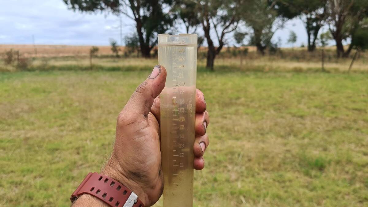 Wet wet wet: Wagga grain farmer Simon Moloney, pictured with his rain gauge, has loved the wet weather. Picture: Contributed