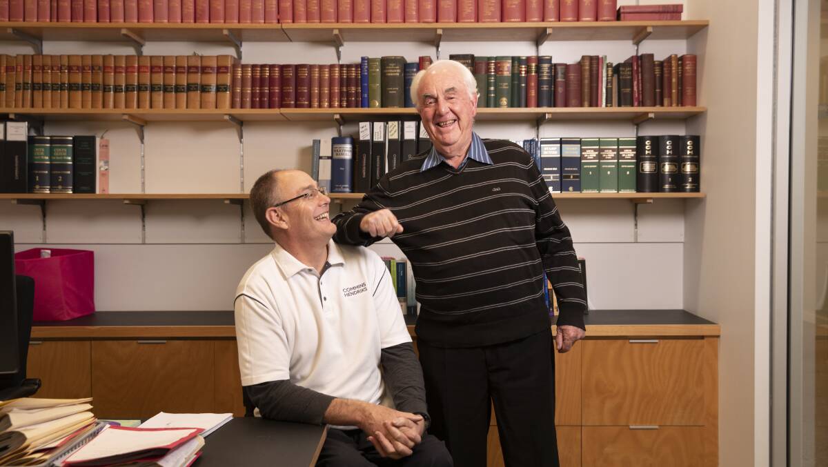 LOVE WHAT YOU DO: Michael Commins and father Fred, of Commins Hendriks Solicitors which this year celebrates 120 years. Picture: Madeline Begley 