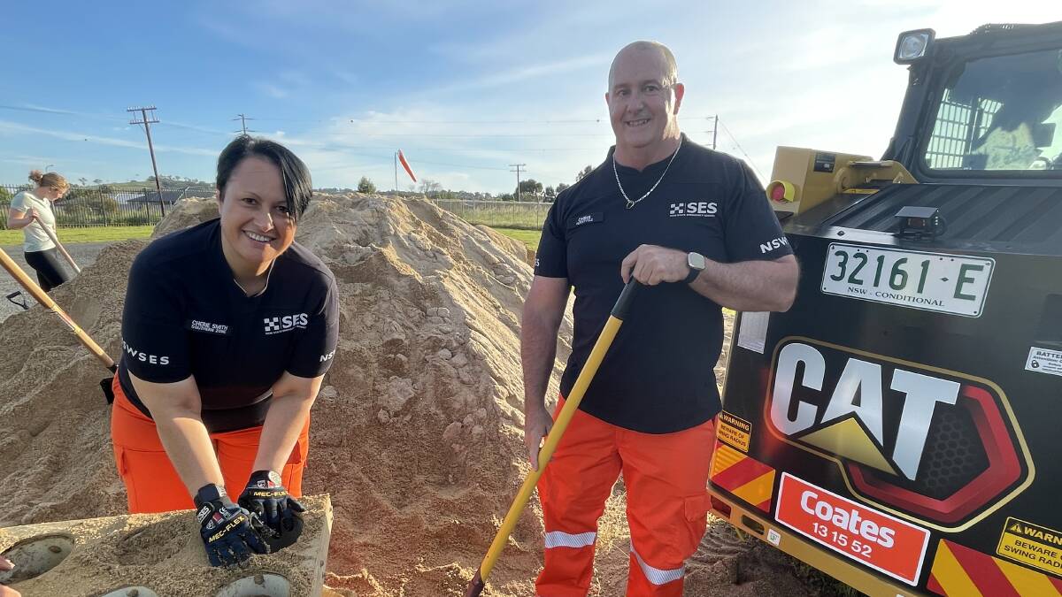 Chris Smith, pictured filling sandbags with wife Cherie, has signed on to fight for the seat of Wagga representing the Shooters, Fishers and Farmers Party in this year's state election. Picture Taylor Dodge