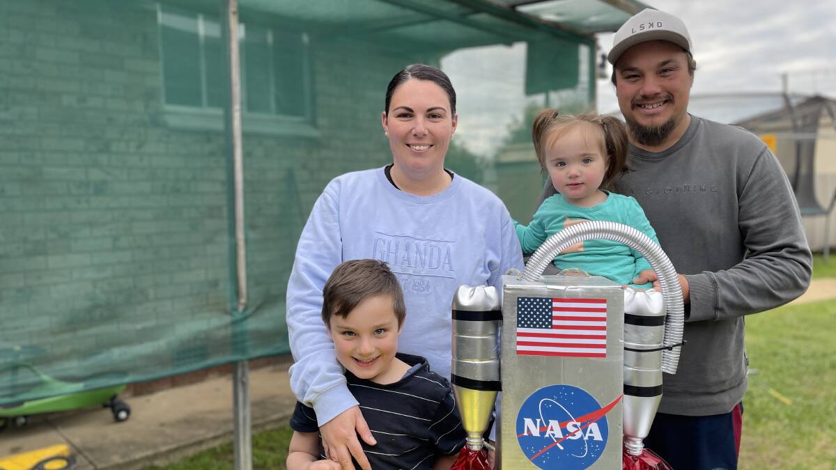 TO INFINITY: Benji Bryon,5, alongside mum Ashley, sister Frankie, 18 months, and Dad Wayne, is heading to Book Week dressed in his homemade astronaut costume. Picture: Conor Burke