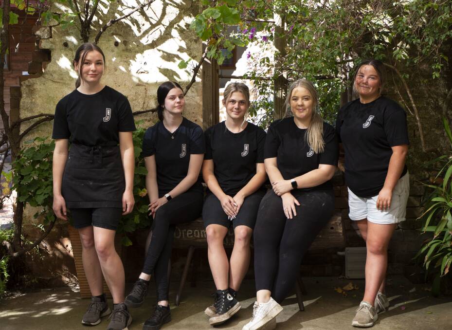 Staffing struggles: Paige Thelan, Rachel Anderson, Bree Scott, Bella Passlow and Georgia Foley are keen to have more staff join them at the Junee Licorice and Chocolate Factory. Picture: Madeline Begley